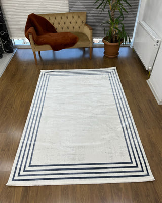 Hera Frame Patterned Machine Made Carpet Blue